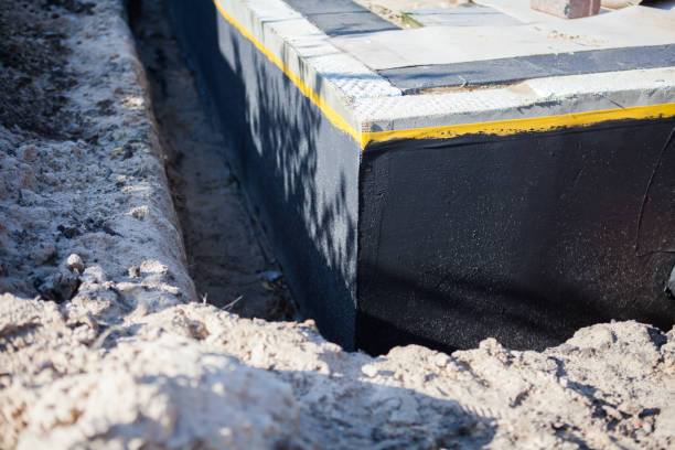 Professional Emergency Waterproofing technician working in Holland, MI